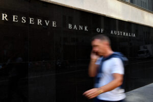 A pedestrian walks past the Reserve Bank of Australia (RBA) building in Sydney, Tuesday, February 4, 2020. (AAP Image/Joel Carrett)