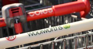 Woolworths and Coles Supermarket signage in Melbourne, Wednesday, February 21, 2024.