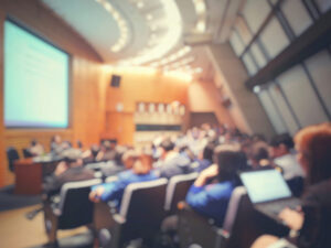 Blur of auditorium room use for present meeting background