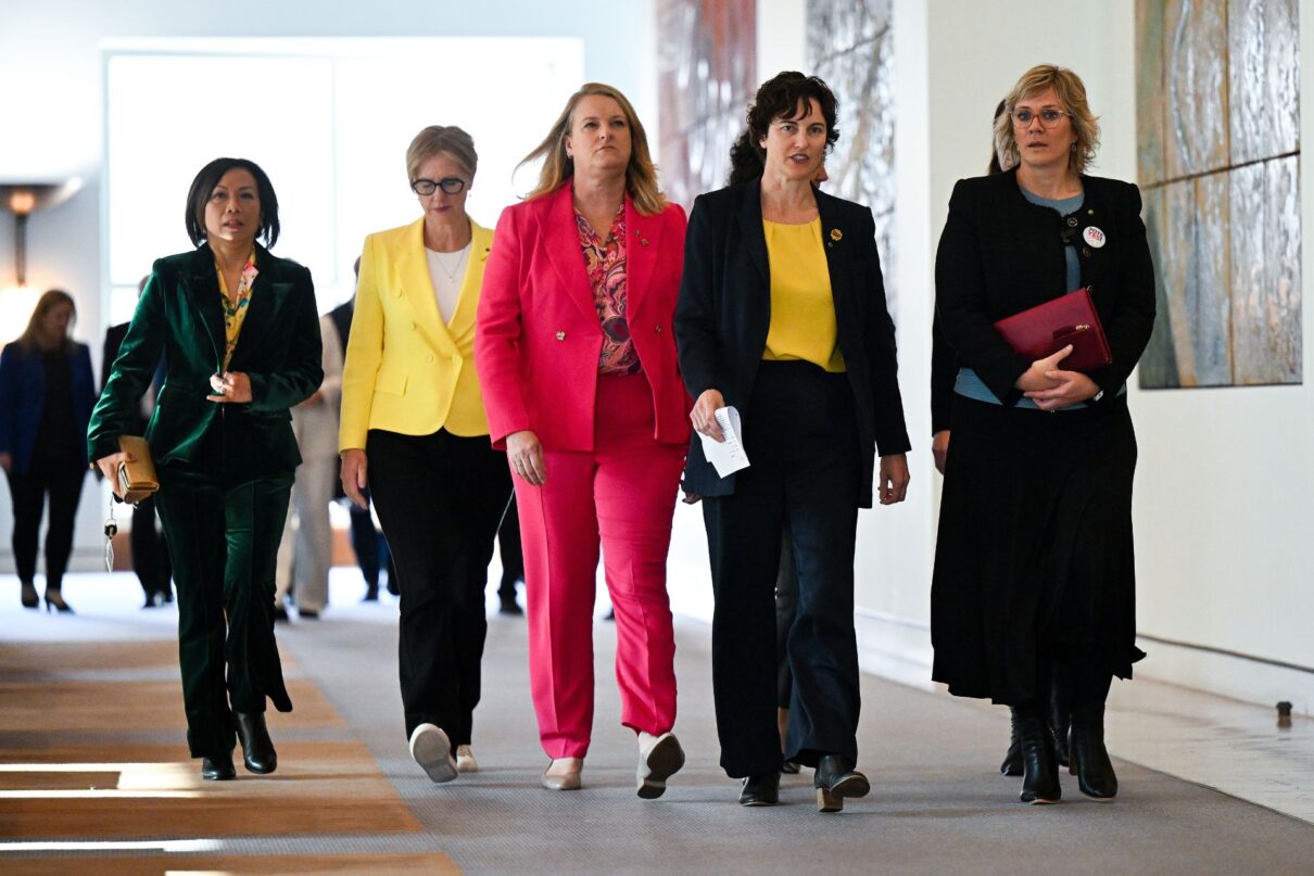 Independent member for Curtin Kate Chaney (centre) and Independent member for Warringah Zali Steggall arrive to speak to the media on a private members bill aimed at political donation and electoral law reform at Parliament House in Canberra, Monday, August 7, 2023.